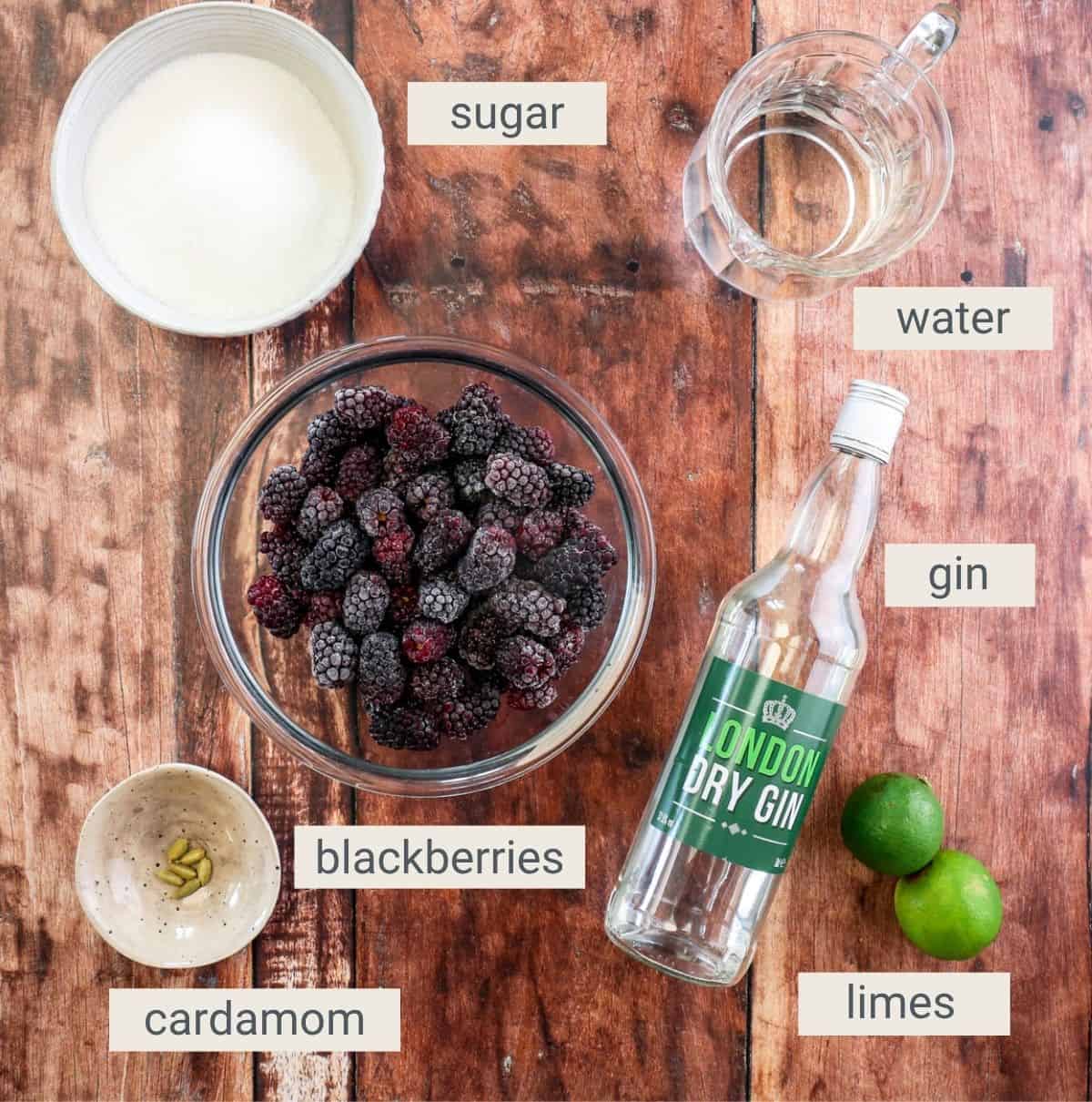 Blackberry Gin Liqueur ingredients on a table.