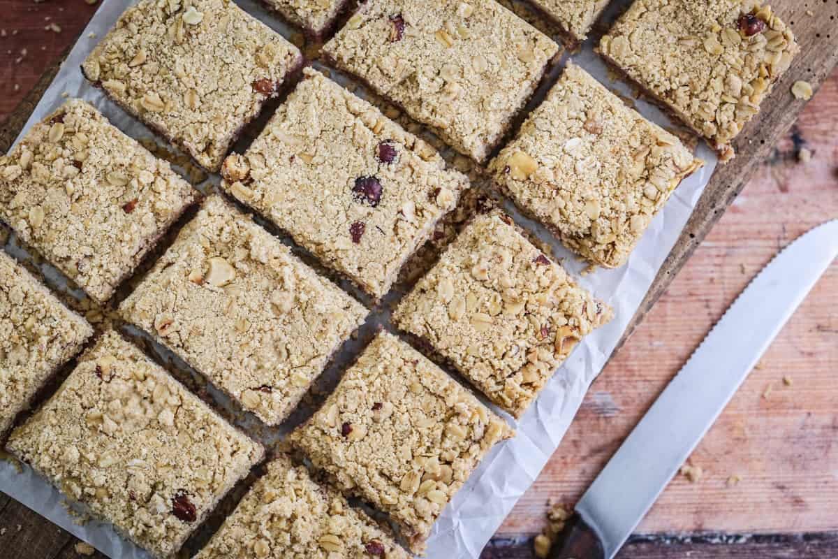Hazelnut Oat Crumble Bars with creamy blackberry cheesecake filling.
