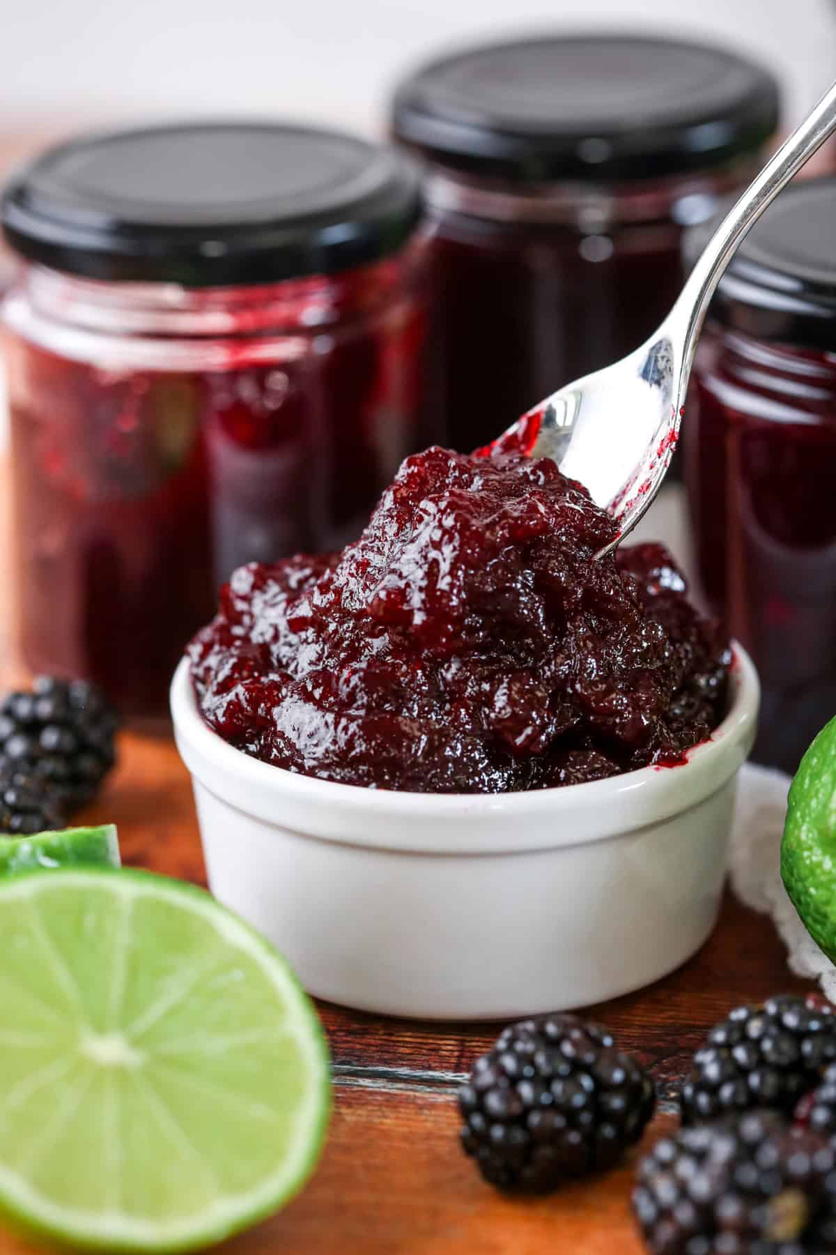 Blackberry Lime Jam spooned out from pot.