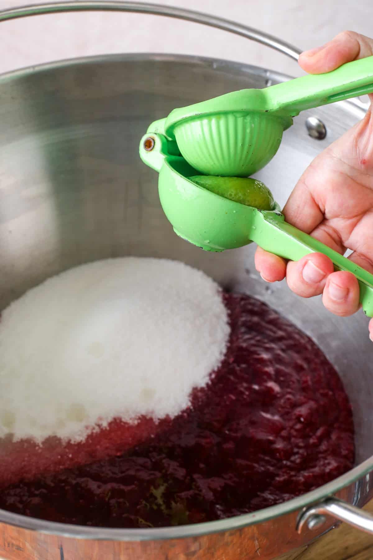 Lime juiced into blackberry pulp and sugar.