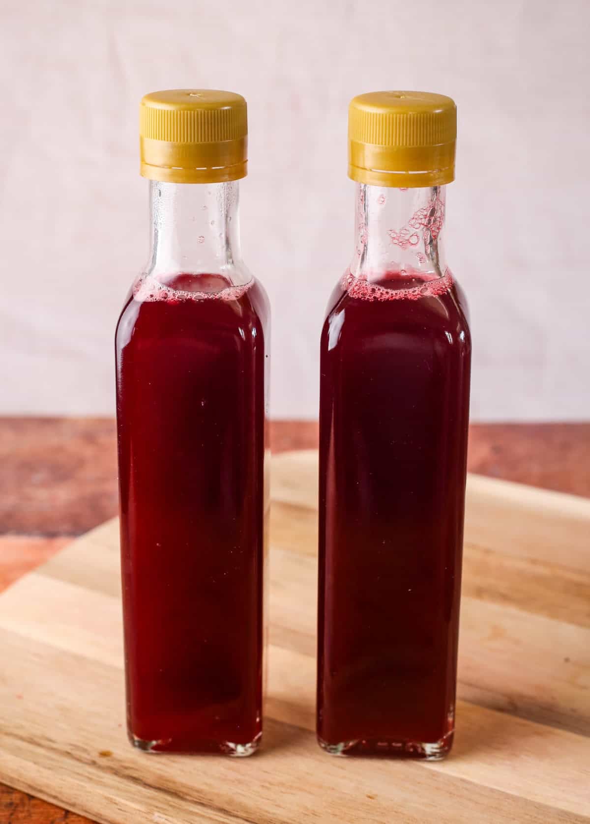Sealed bottles of Homemade Blackberry Vinegar.