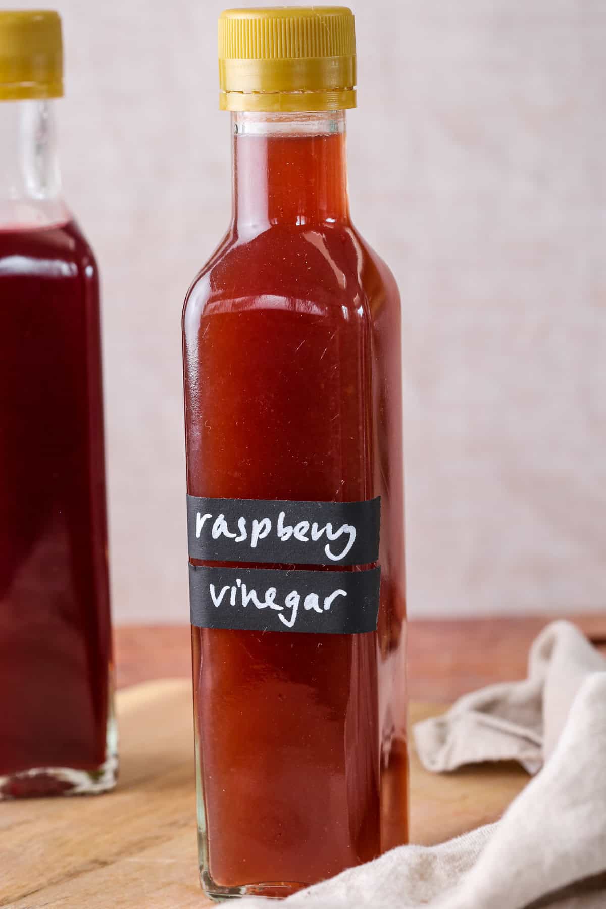Sealed bottle of homemade raspberry vinegar.