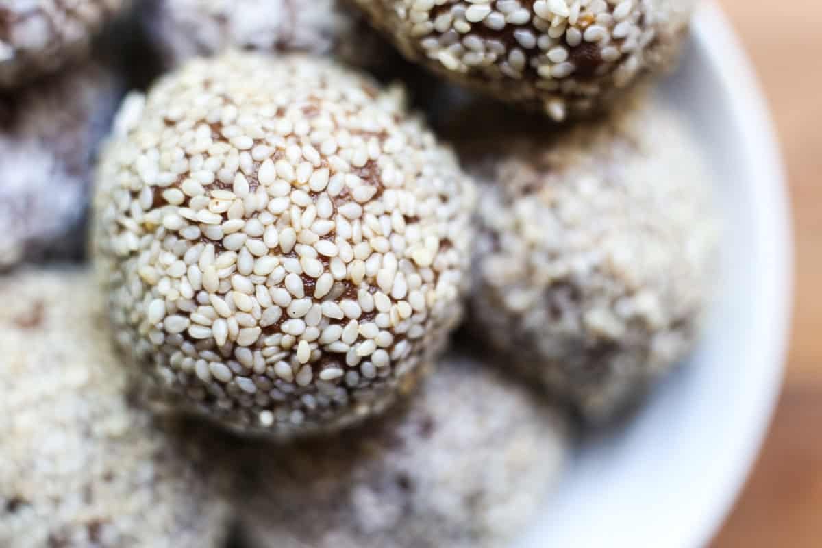 Bowl of Chocolate Tahini Date Energy Balls.