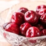 Kirsch Cherries drained in a glass bowl.
