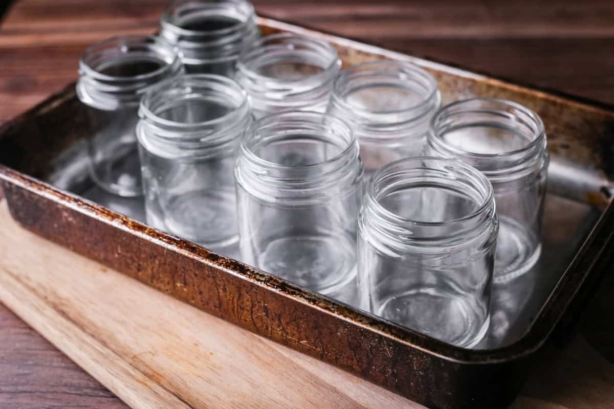 Glass jars in a baking tray.