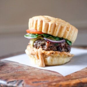Juicy Gluten-Free Meatloaf Burger in a Brazilian cheese bun, burger sauce and salad.