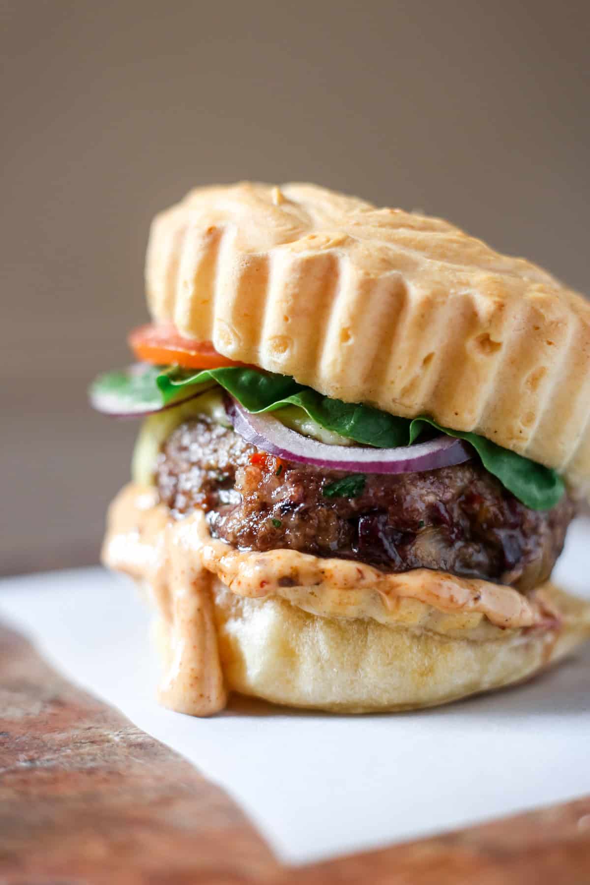 Juicy Gluten-Free Meatloaf Burger in a Brazilian cheese bun, burger sauce and salad.