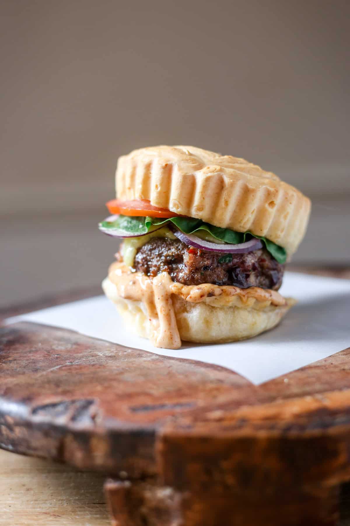Juicy Gluten-Free Meatloaf Burger in a Brazilian cheese bun, burger sauce and salad.