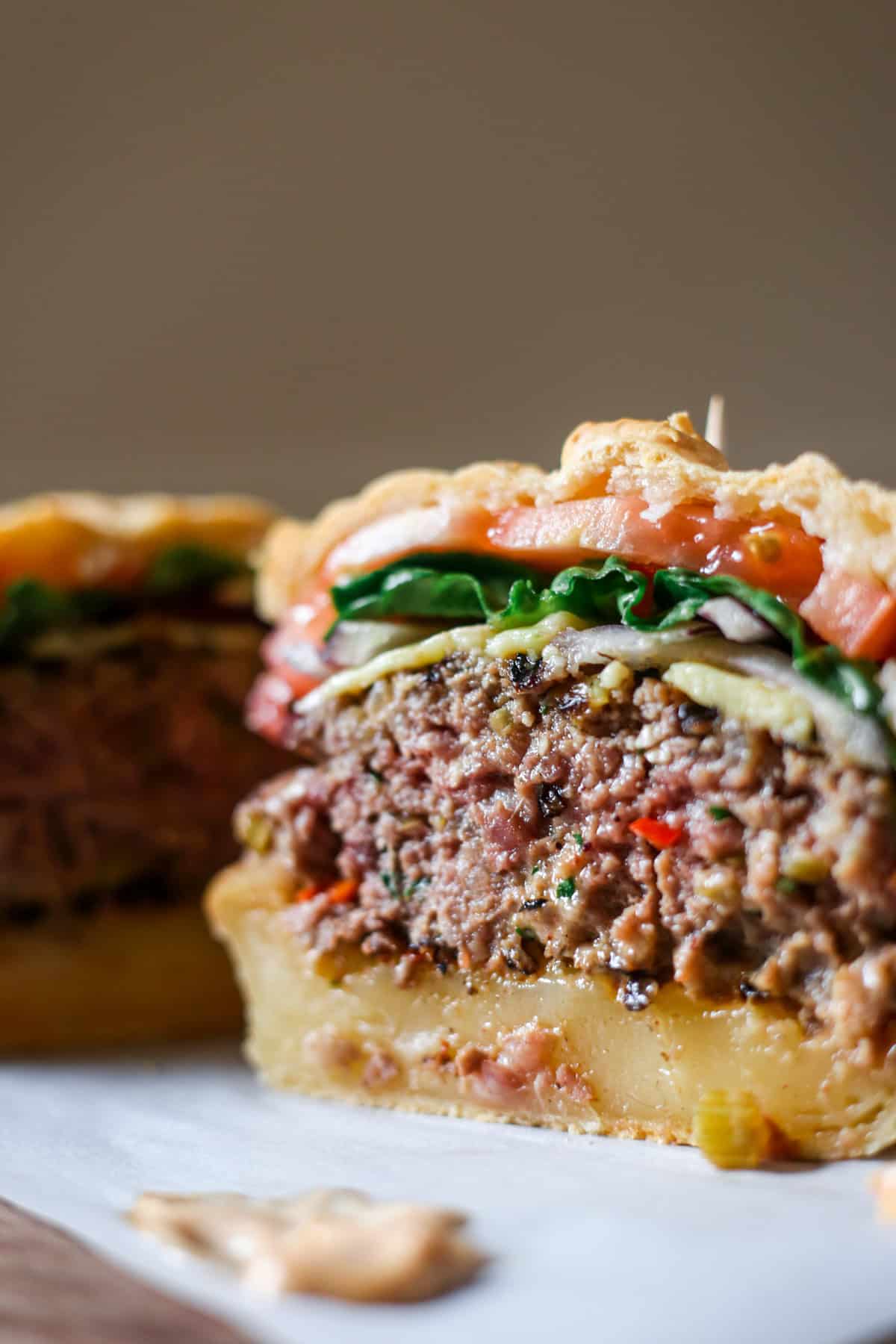 Burger cut in half showing very juicy inside.