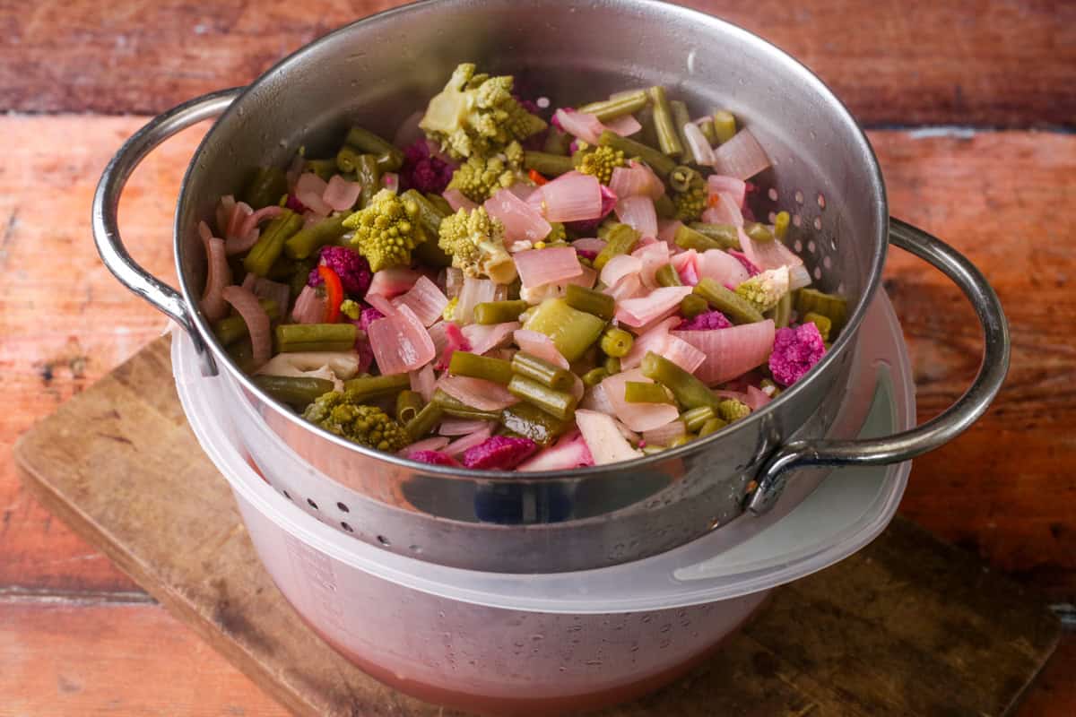 Drained piccalilli vegetables.